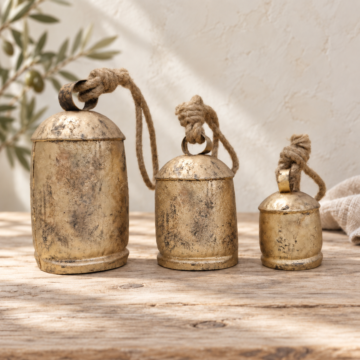 Graduated Rustic Bells — Set of 3 with a rustic gold-tone finish and natural jute ropes