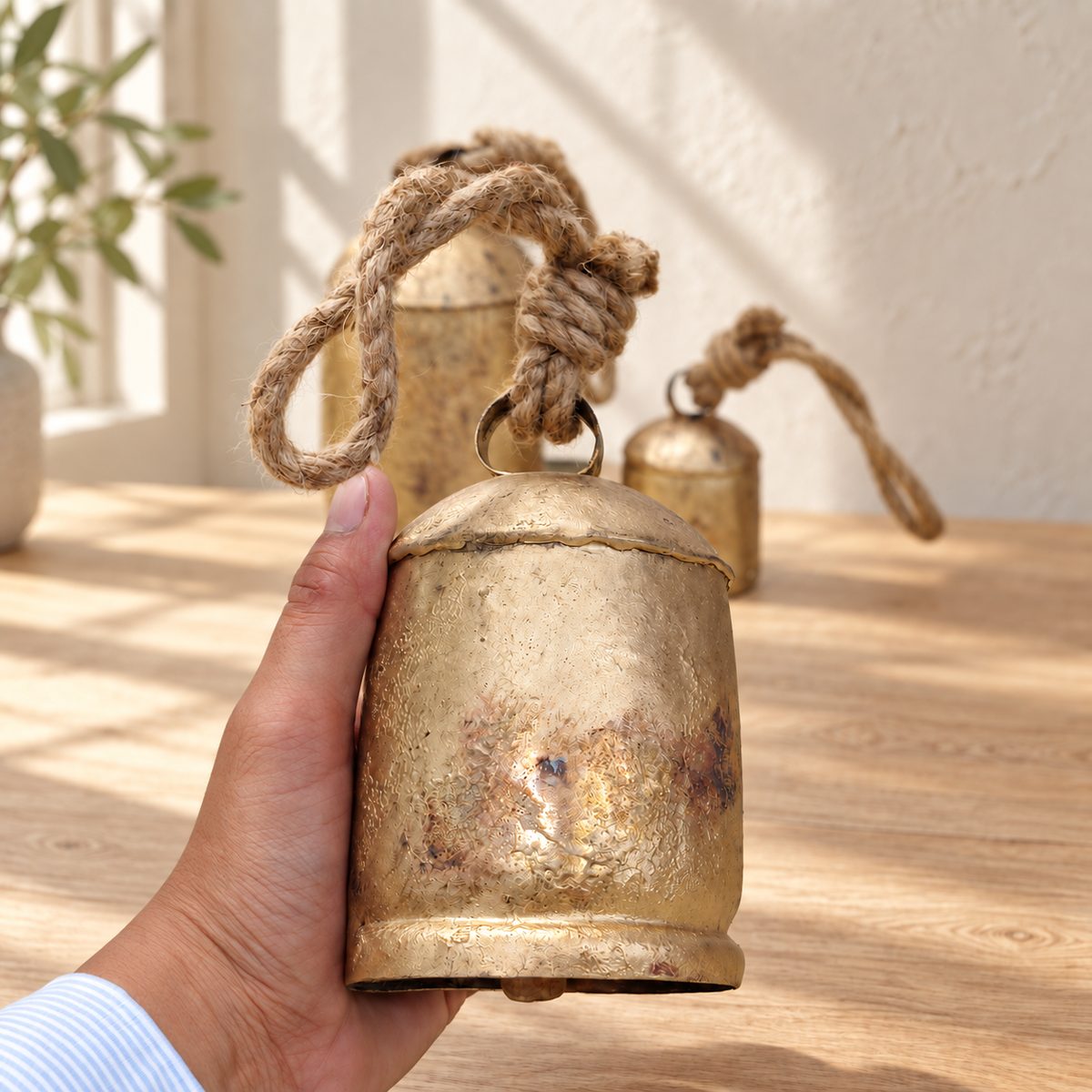 Graduated Rustic Bells — Set of 3 with a rustic gold-tone finish and natural jute ropes