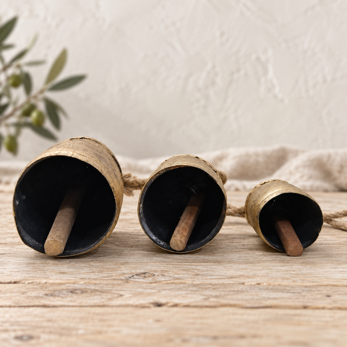 Graduated Rustic Bells — Set of 3 with a rustic gold-tone finish and natural jute ropes