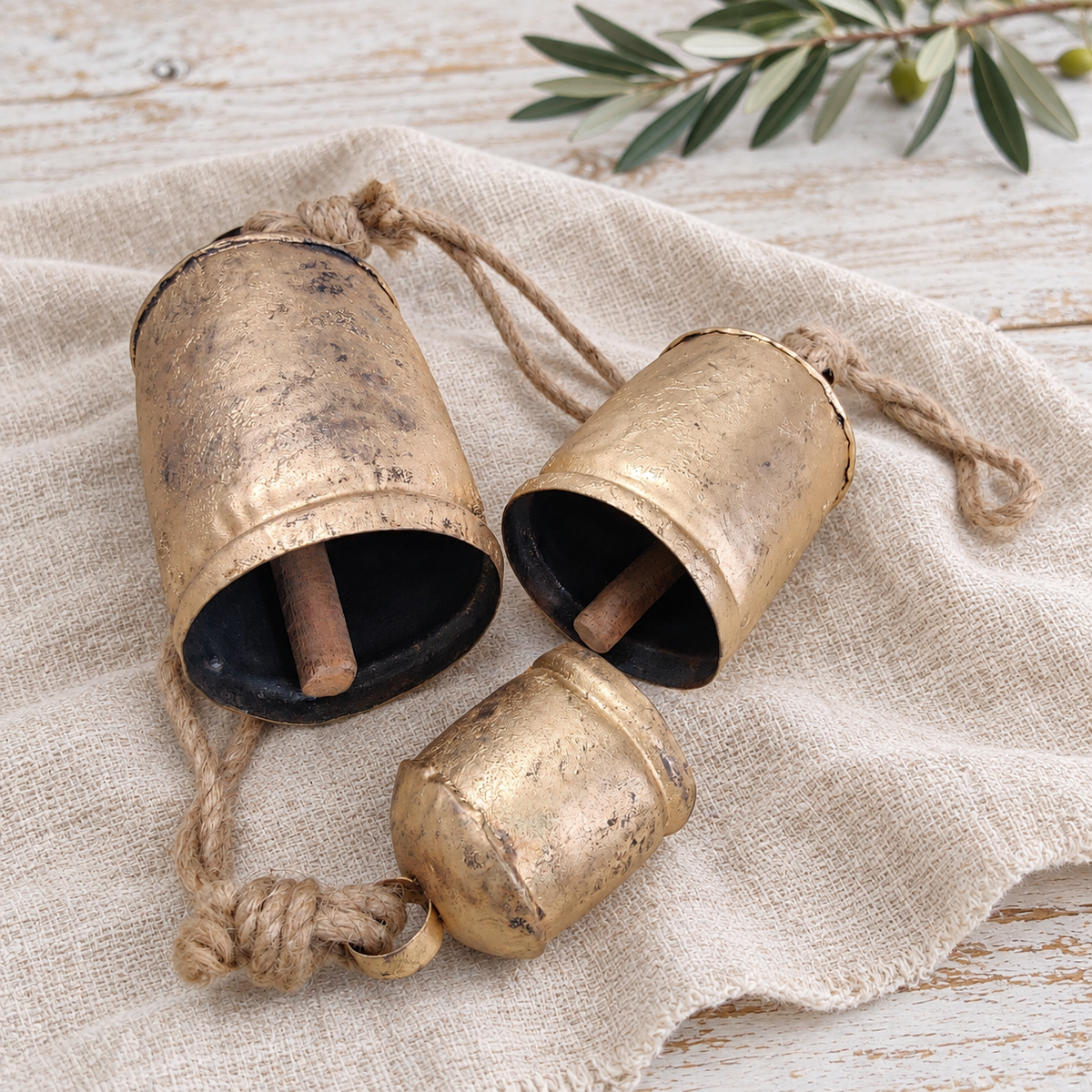 Graduated Rustic Bells — Set of 3 with a rustic gold-tone finish and natural jute ropes